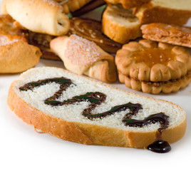 image slice of white bread watered with liquid chocolate and cookies