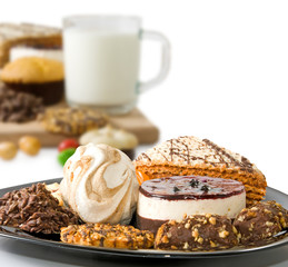 isolated image of cup of milk and many delicious cookies close-up