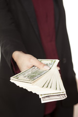 female hand holding a bunch of money