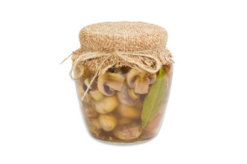 Pickled button mushrooms in glass jar