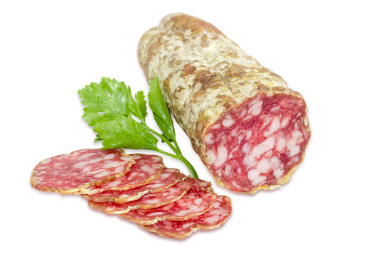 Salami and sprig of parsley  on a light background