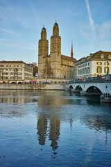 Deurstickers Reflection of Grossmunster church in Limmat River, City of Zurich, Switzerland © Stoyan Haytov