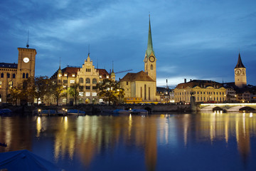 Naklejka na ściany i meble Night panoramic photo of city of Zurich and reflection in Limmat River, Switzerland
