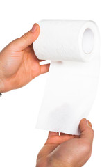 Hand holding toilet paper roll