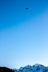 Sunset  vith paraglide over winter Alps
