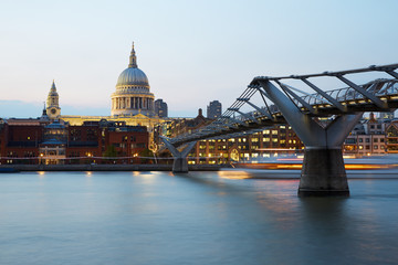 Fototapeta na wymiar St Paul's cathedral and Millennium bridge in London in a clear evening