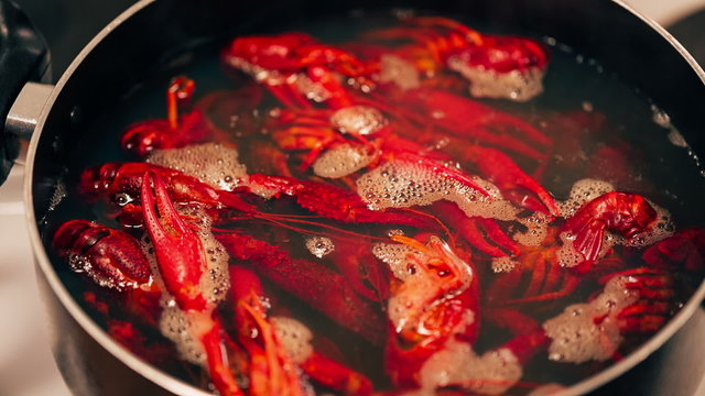 Crayfish are boiled in a pot.