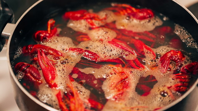 Crayfish are boiled in a pot.