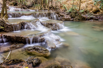 tropical waterfall in deep forest of Kanchanaburi province, Thailand