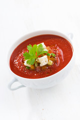 fresh gazpacho with croutons in a bowl, vertical