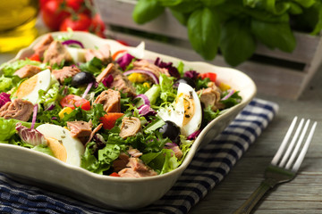 Tuna salad with lettuce, eggs and tomatoes.