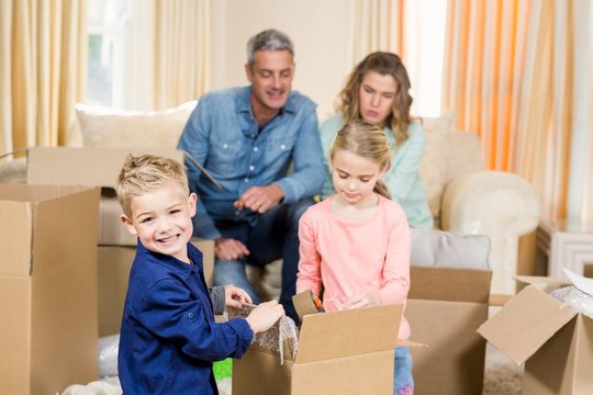 Cute Family Opening Boxes