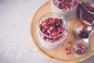Chia seeds pudding with pomegranate, selective focus,toning