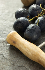corkscrew and grape