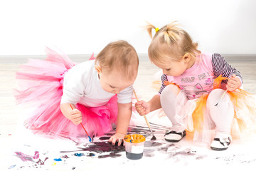 Fototapeta premium Children, little girls paint colors 