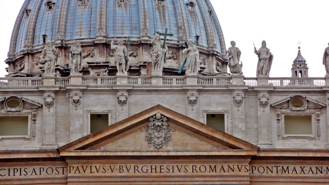 Statues and Latin engravings on basilica facade