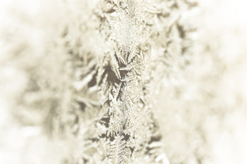 Frozen patterns on a window. Winter nature background. Selective