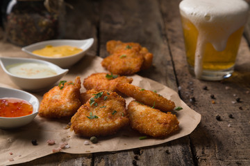 Chicken nuggets on rustic wooden table