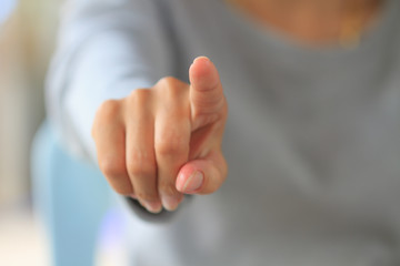 Woman touching an imaginary screen with her finger