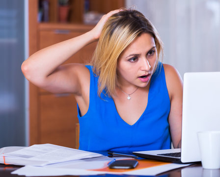 Tired Female Employee Doing Paperwork