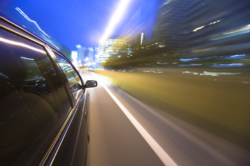 Obraz na płótnie Canvas Night drive with car in motion.