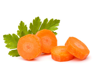 Chopped carrot slices and parsley herb leaves still life isolate