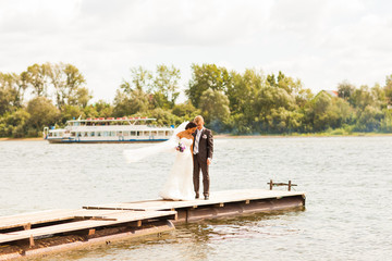  wedding couple  on the pier near big lake