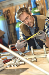 Worker in metallurgy workshop