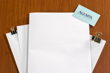 Agenda; White Blank Documents with Small Message Card.