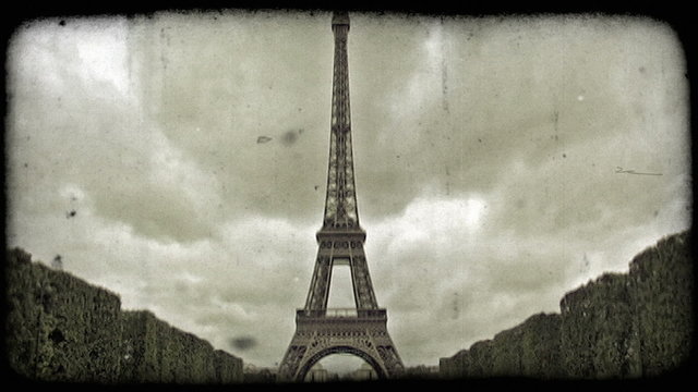 Front of Eiffel Tower. Vintage stylized video clip.