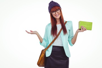 Smiling hipster woman with bag and book