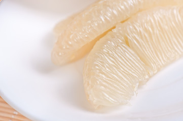 grapefruit slice on white plate