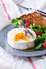 Goat cheese with honey and raspberries
