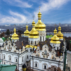 Fototapeta na wymiar Kiev, Ukraine. Cupolas of Pechersk Lavra Monastery, river Dniepr