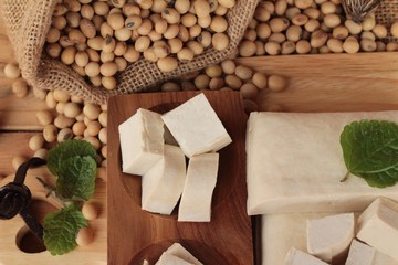 Fototapeta na wymiar Tofu for cooking and soybean seed.