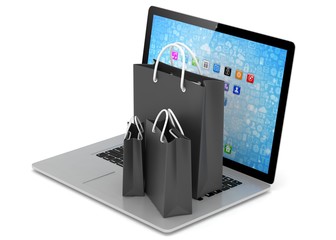 laptop and  shopping pags on white background