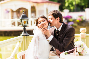 Bride and groom having a romantic moment on their wedding day 