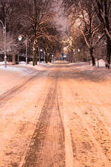 Night snowy road light with lanterns