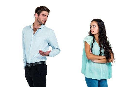 Couple standing back to back while arguing