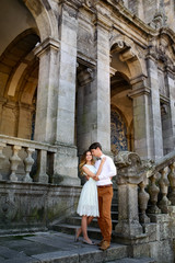 Fototapeta na wymiar gentle happy stylish romantic couple on the background of castle