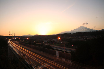Fototapeta na wymiar Mount Fuji and highway at sunset.