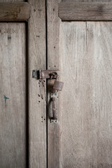 Old rusty locks on wooden door
