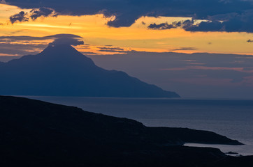 Greek coast of aegean sea at sunrise near holy mountain Athos