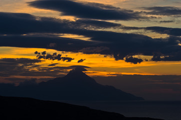 Greek coast of aegean sea at sunrise near holy mountain Athos