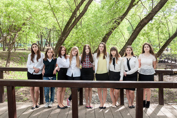 a group of young girls posing in park