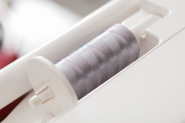 grey thread in Sewing machines shallow depth of field (soft focu