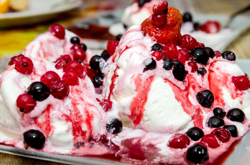 delicious vanilla ice cream with fruit in plate