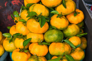 Fresh exotic tropical fruits for sale at an outdoor market.