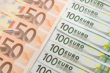 banknotes 50 and 100 euro closeup as background