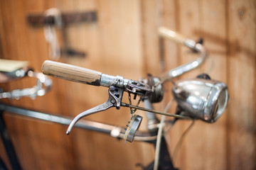 Old bicycle on wooden background